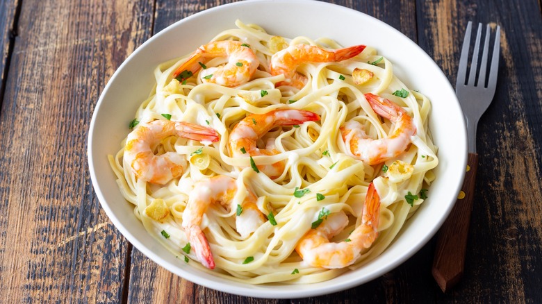Prawn linguine served in white bowl