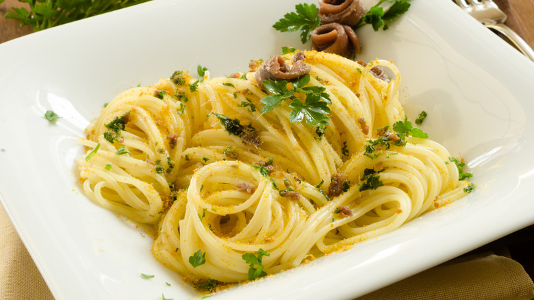 Close up of spaghetti with bottarga and anchovies