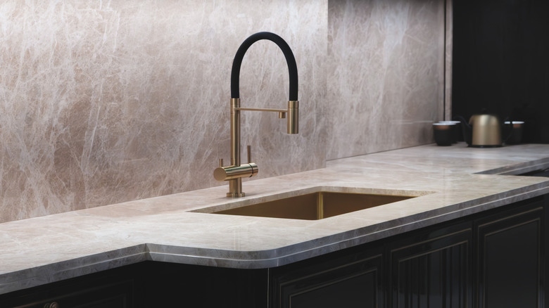 A faucet is shown in a modern kitchen.