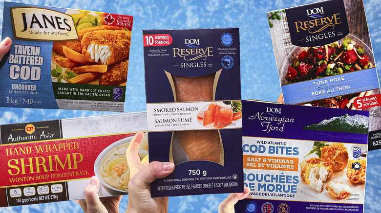 Packages of frozen seafood items being held up