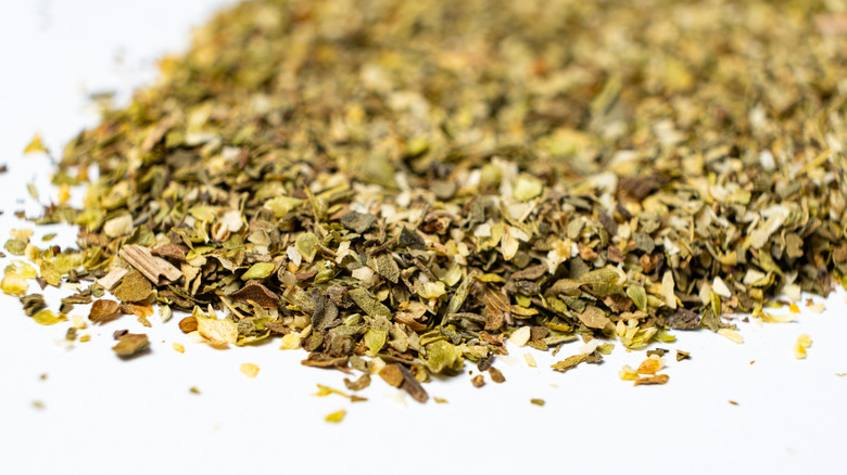 Dried herb blend on a white surface