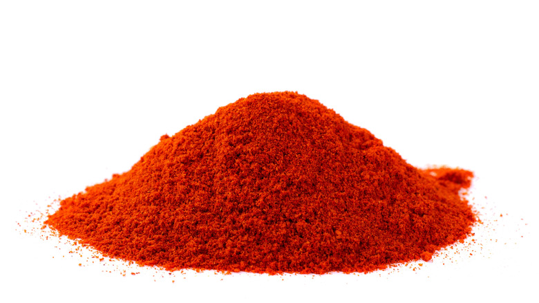 A heap of paprika on a white background