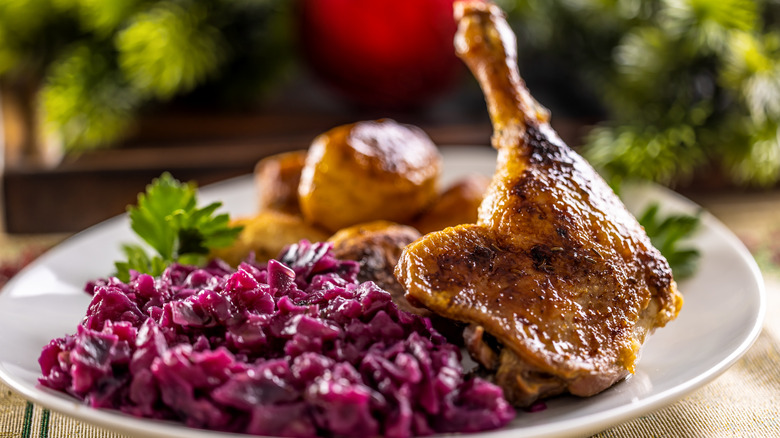 Roasted duck leg on plate