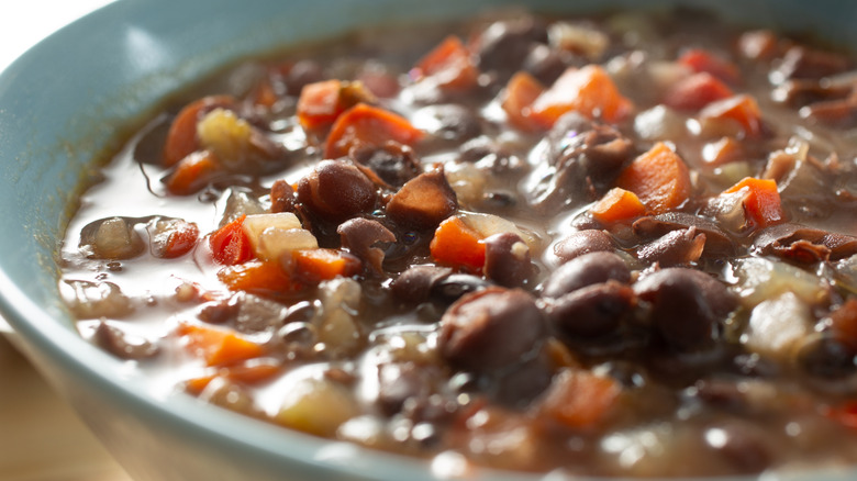 Black bean soup with red tomatoes