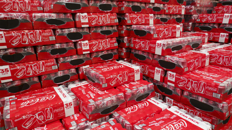 Cases of canned Coca-Cola at a store