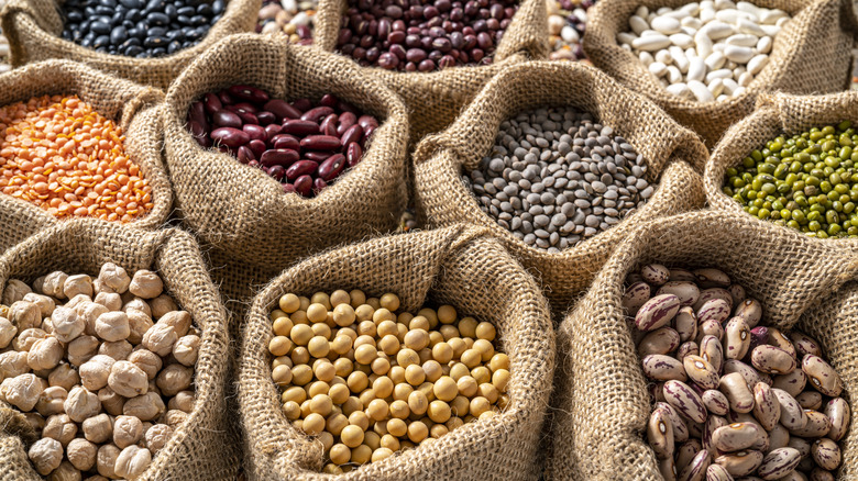 A variety of legumes in burlap sacks