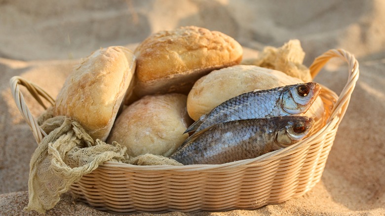 Basket of bread and two silver-scaled fish