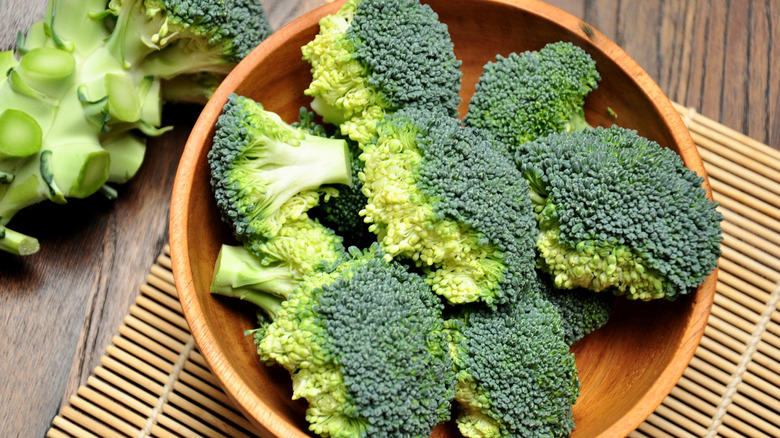 Broccoli florets in a wooden bowl