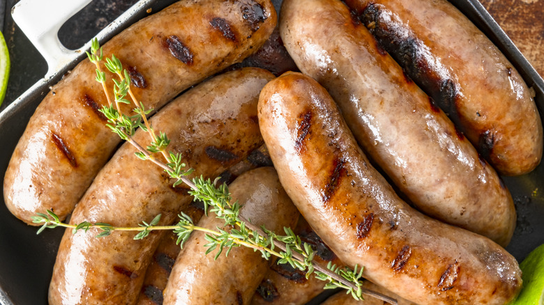 Grilled Italian sausage with fresh thyme on top