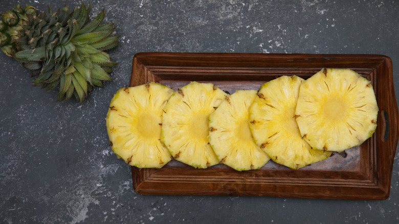 pineapple slices on a cutting board