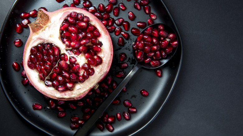 Pomegranate arils spread on a plate