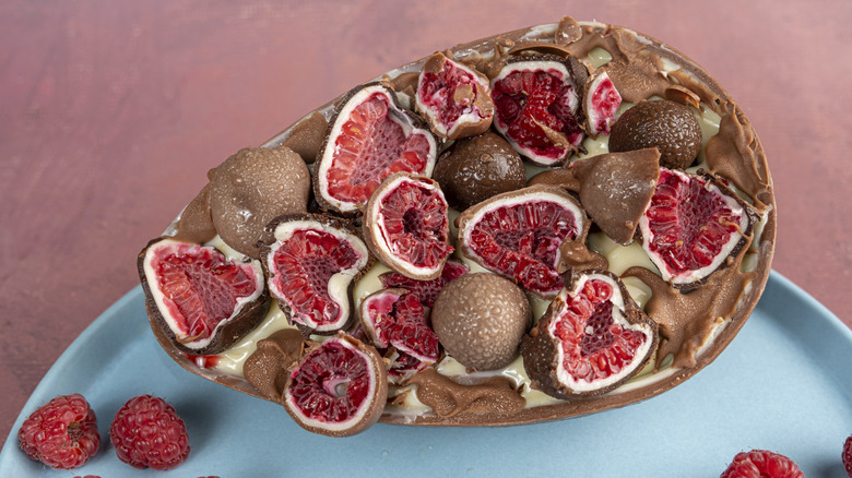 a bowl of chocolate covered raspberries