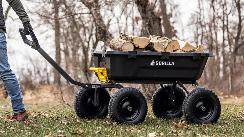 A Gorilla garden wagon near a wood pile