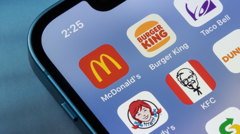A smartphone with a variety of fast food apps