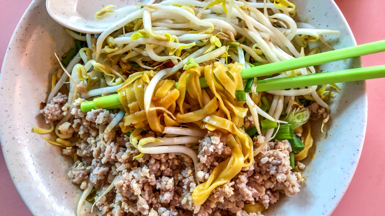 A bowl of bak chor mee with chopsticks