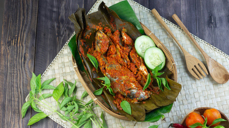 A basket of pepes ikan (fish cooked in banana leaves)