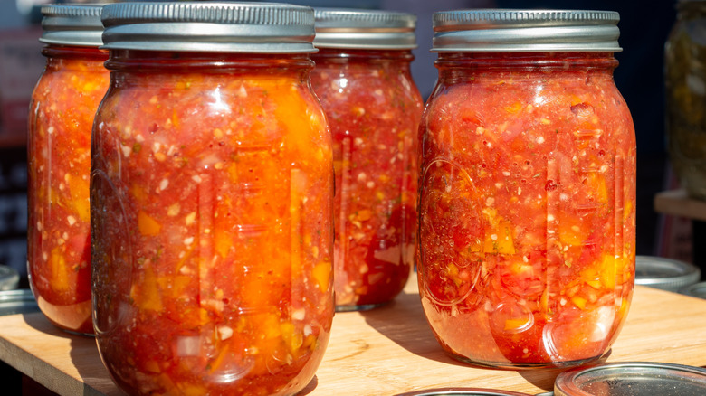 Four jars of red jalapeño purée