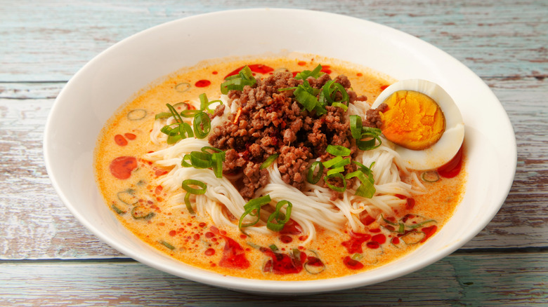 Tantanmen, soupy sesame noodles garnished with chile oil