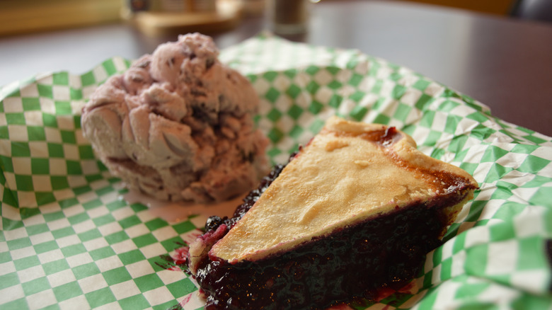 Huckleberry pie and ice cream on a plate