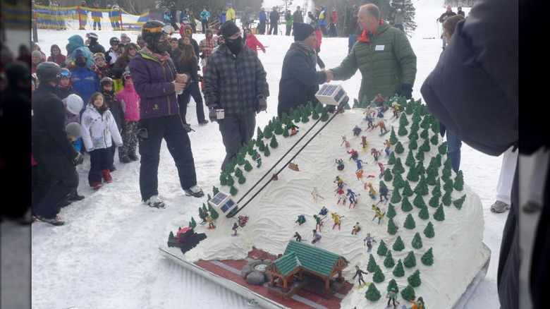 The Cake Boss delivers a ski-themed cake to a ski resort