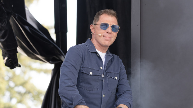 Bobby Flay on stage during a cooking demonstration