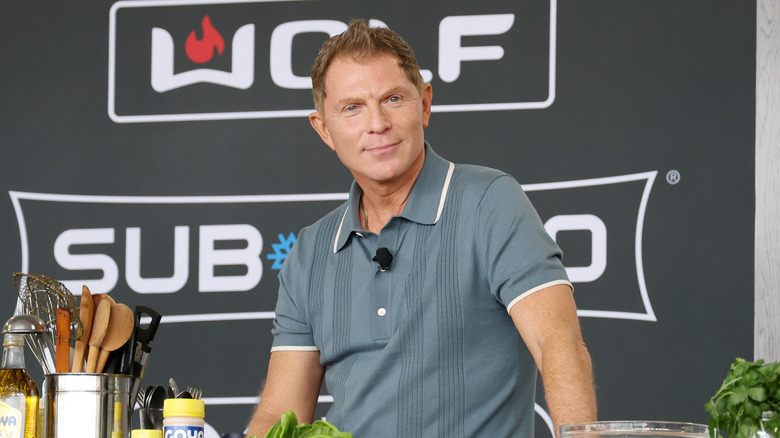 Bobby Flay on stage during a cooking competition