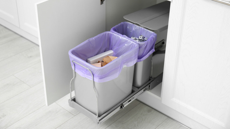 Open kitchen base cabinet for two trash cans