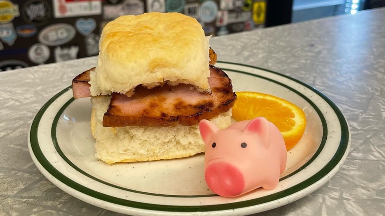 Thick sliced ham on a biscuit