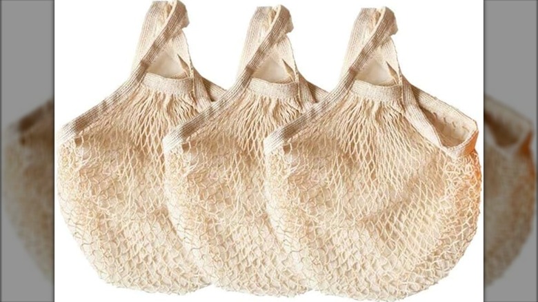 Mesh shopping totes on white background