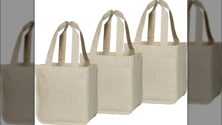 Organic Cotton Mart three canvas bags on white background