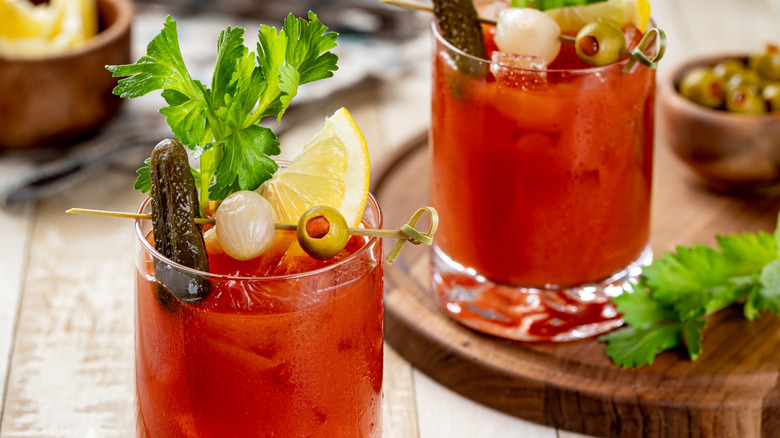 Bloody Mary with onion, pickle, celery, and lemon garnish
