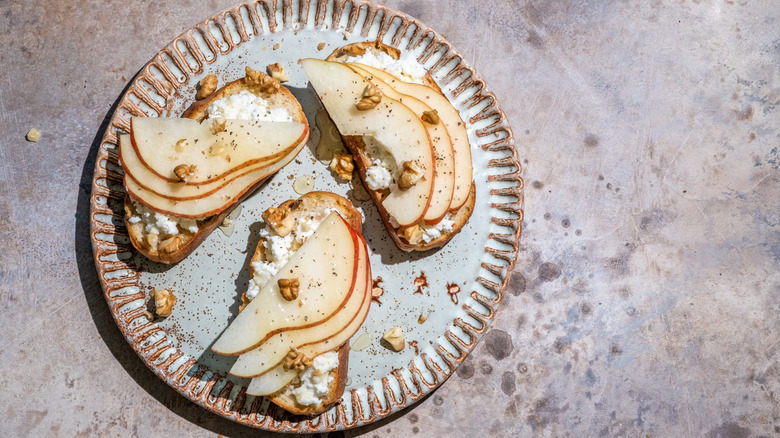 Pear and goat cheese crostini on a plate