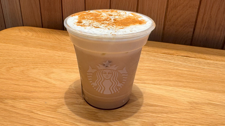 Iced Banana Bread Chai on a wooden table