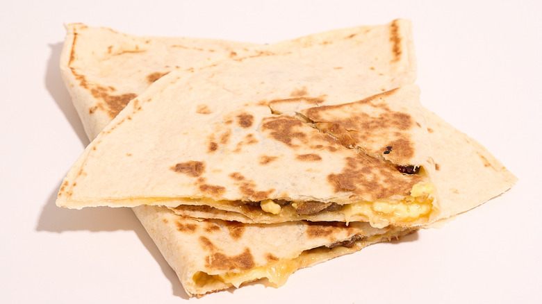 steak breakfast quesadilla on a white table