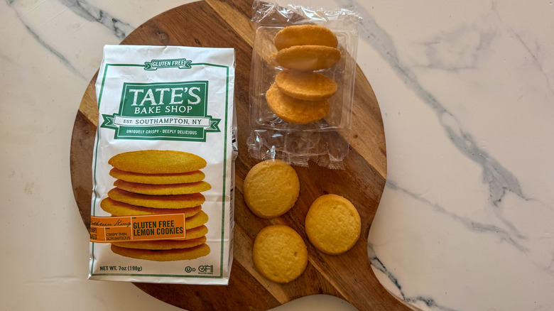 Tate's Gluten Free Lemon Cookies on round, wooden cutting board