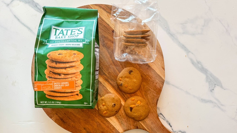 Tate's Salted Caramel Chocolate Chip Cookies on round, wooden cutting board