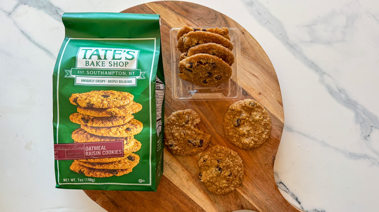 Tate's Oatmeal Raisin Cookies on round, wooden cutting board