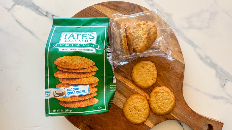 Tate's Coconut Crisp Cookies on round, wooden cutting board