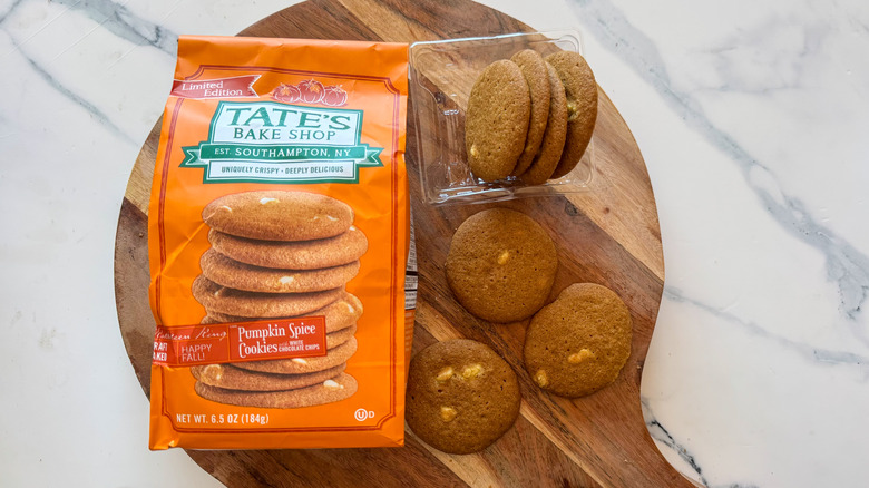 Tate's Pumpkin Spice Cookies on round, wooden cutting board