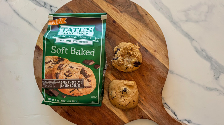 Tate's Soft Baked Dark Chocolate Chunk Cookies on round, wooden cutting board