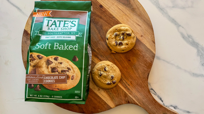Tate's Soft Baked Chocolate Chip Cookies on round, wooden cutting board