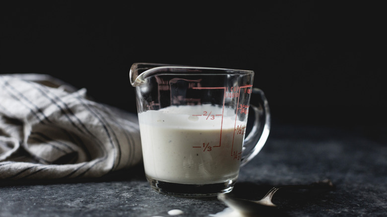Buttermilk in a glass measuring cup