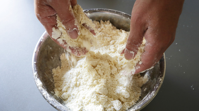 Person mixing scone dough