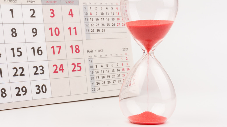 A calendar and an hourglass