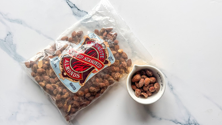 Mesquite-smoked seasoned almonds on marble surface