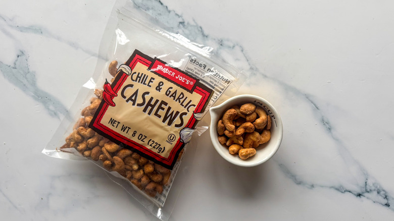 Chile and garlic cashews on marble surface