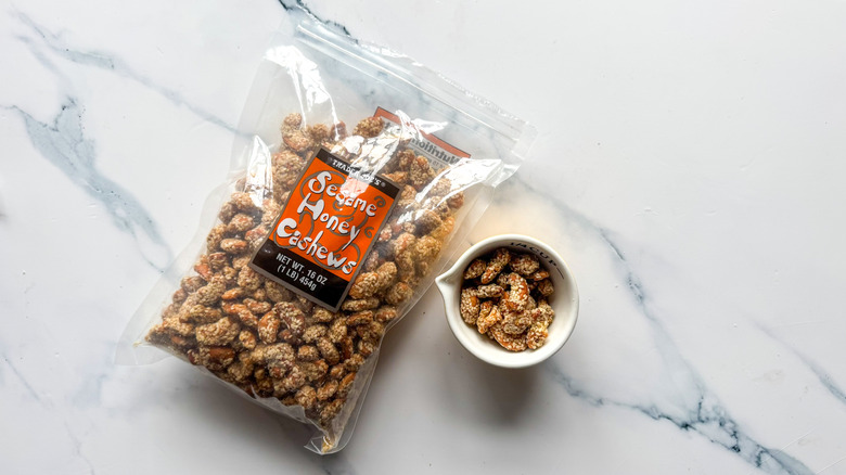 Sesame honey cashews on marble surface