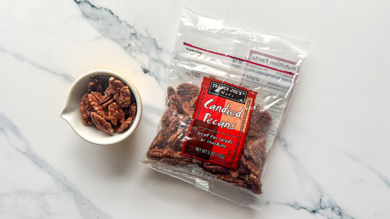 Candied pecans on marble surface