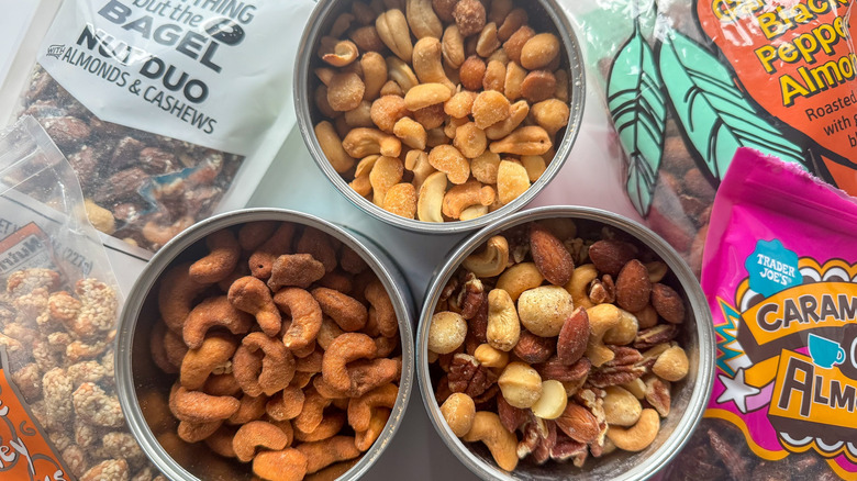 Containers of nuts on marble surface