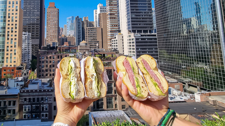 two bagels cut half with NYC skyline in the background